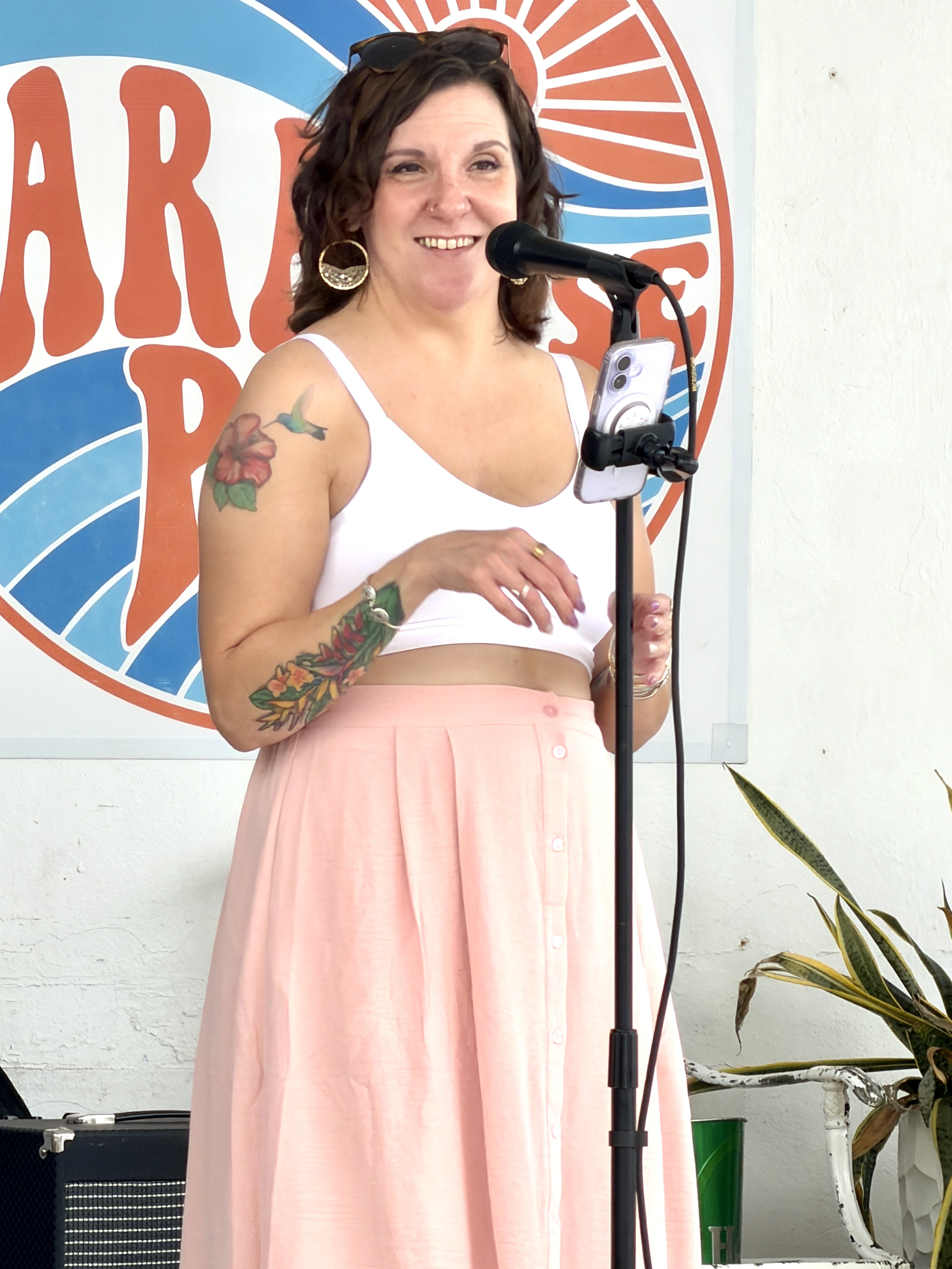 Heat Seekers vocalist Stef smiling while singing at Sapphire Beach Bar live music St Thomas